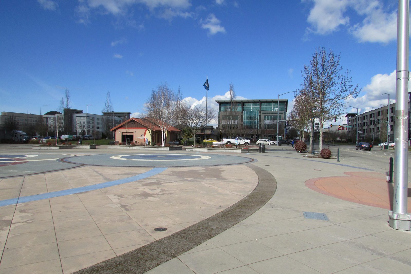 Town Square Plaza in downtown Kent, with its circular paving, street trees, and the buildings of the town center beyond