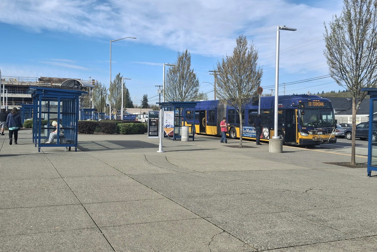 Buses at the Kent Transit Center bus bays beside the Sounder platform at Kent Station