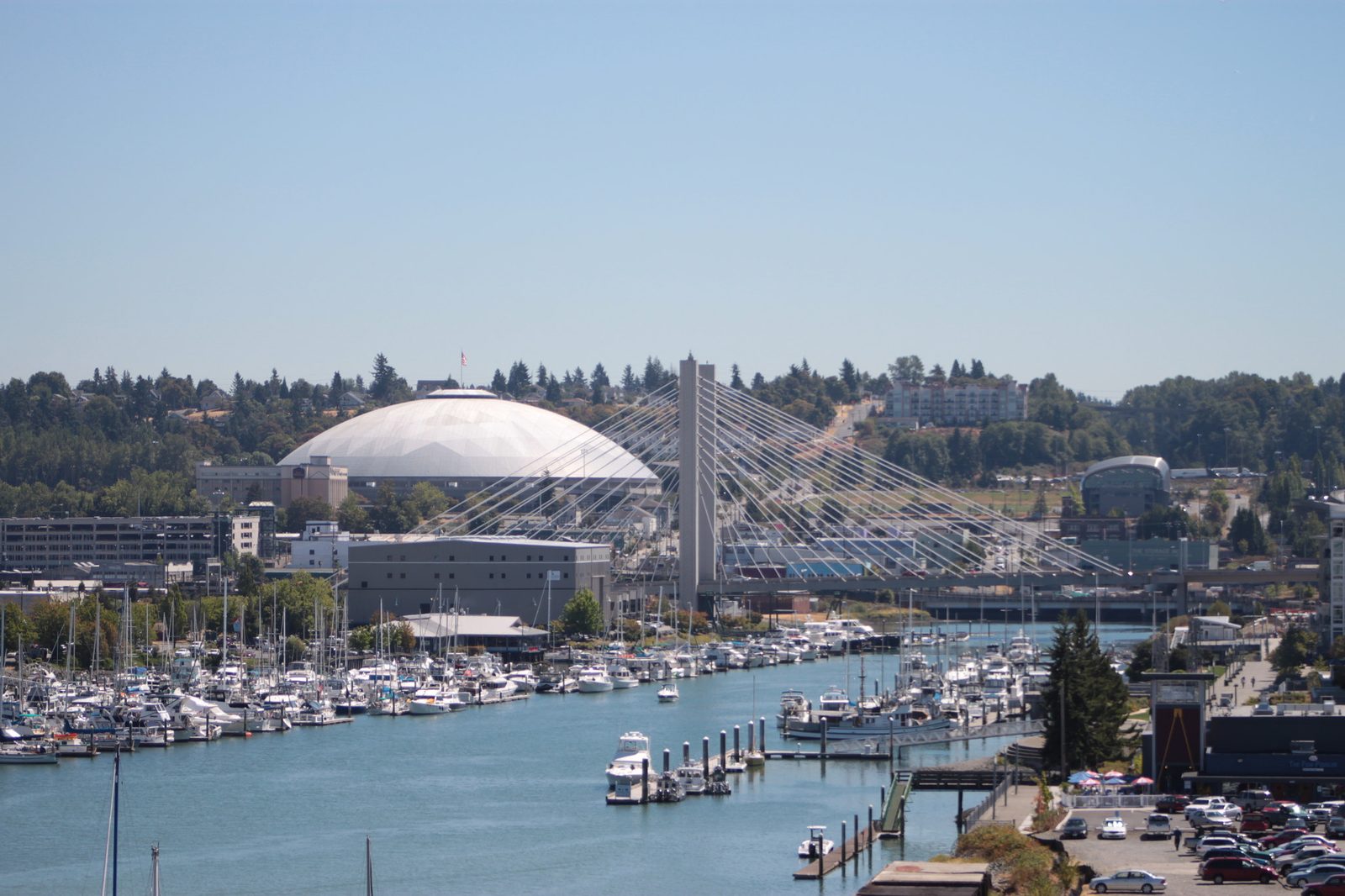 The Tacoma Dome and the 21st Street cable-stayed bridge over the Thea Foss Waterway, with the marina in front and the downtown hillside behind